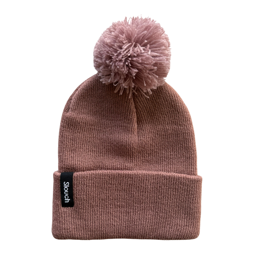 Clay knit beanie with pom-pom on a white background
