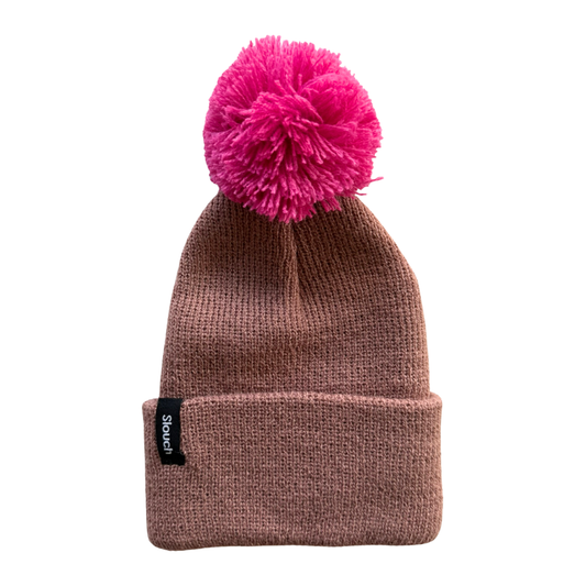 Clay knit beanie with a pink pom-pom on a white background