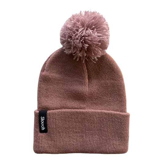 Clay knit beanie with pom-pom on a white background
